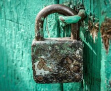Rusty Padlock On Blue Door ALT